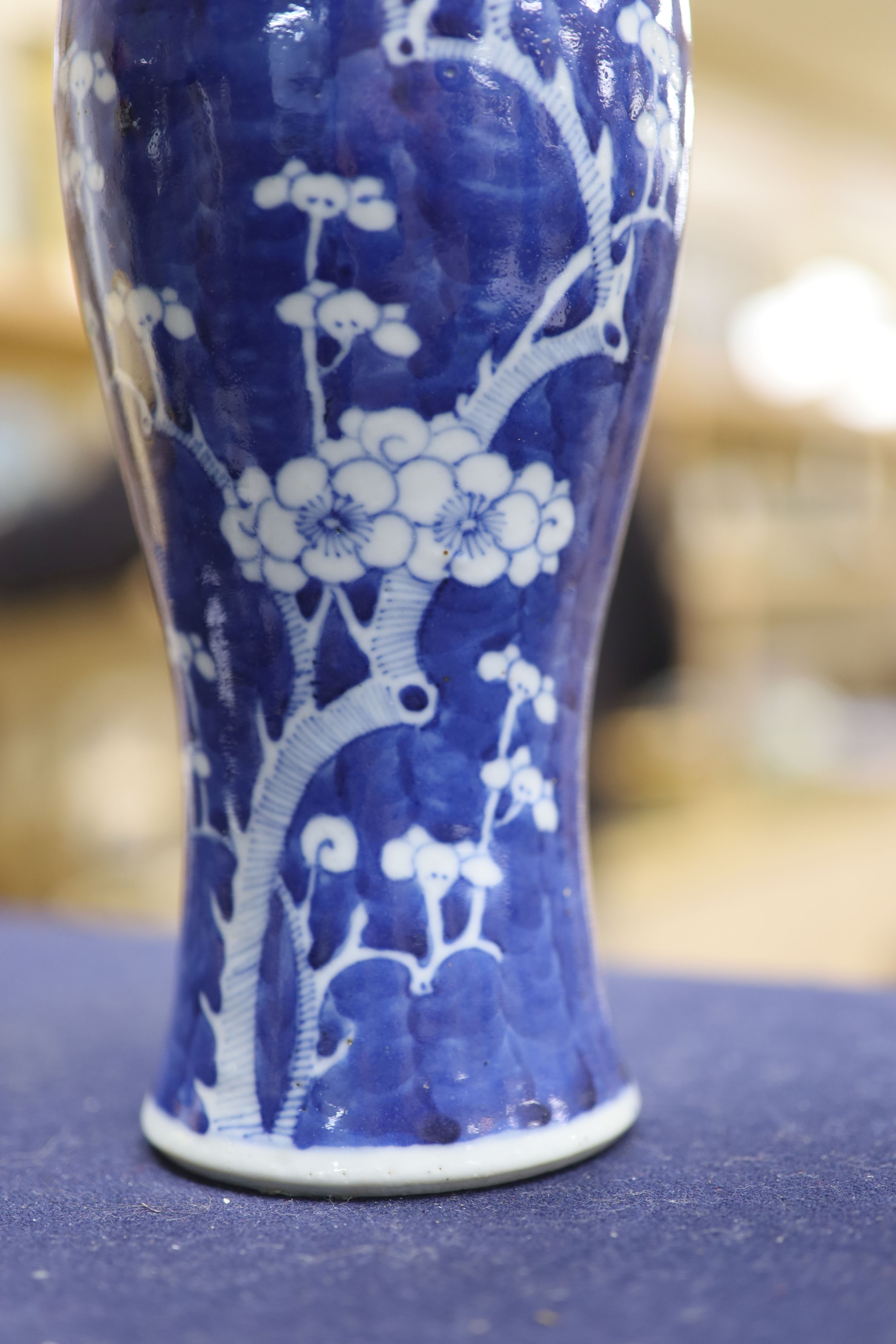 A pair of slender Chinese blue and white prunus vases, late 19th century, height 30cm